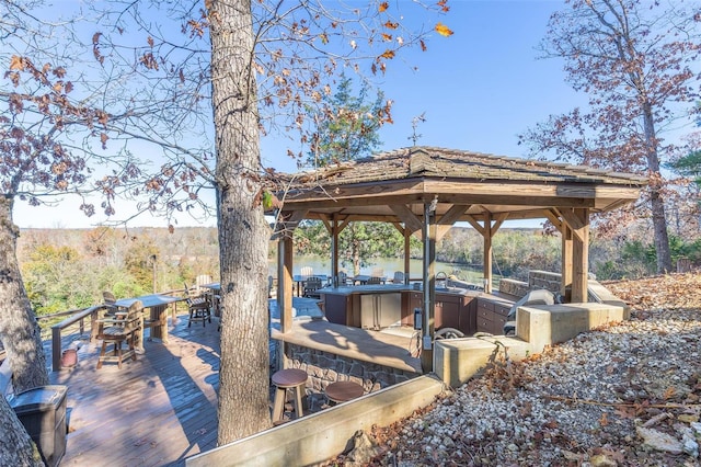 view of home's community featuring area for grilling and a deck