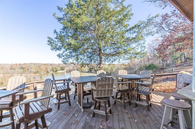 wooden deck featuring a water view