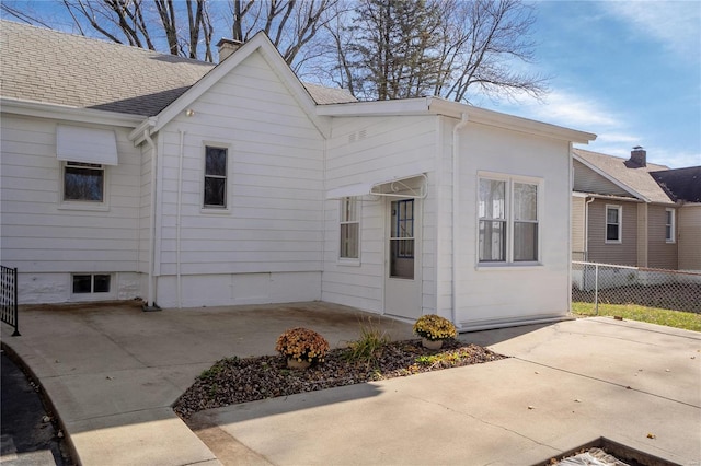 view of side of home featuring a patio area