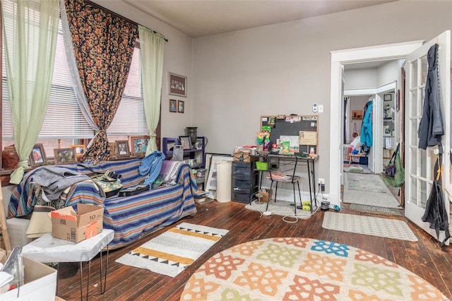 bedroom with dark hardwood / wood-style floors