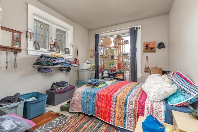 bedroom with hardwood / wood-style flooring