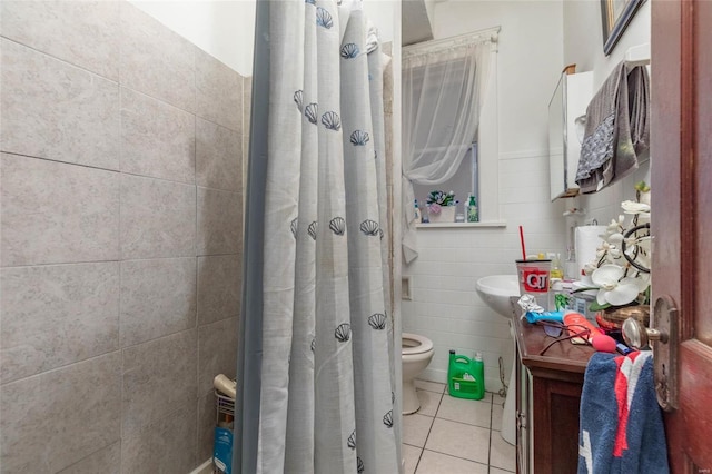 bathroom featuring tile patterned flooring, toilet, tile walls, and walk in shower