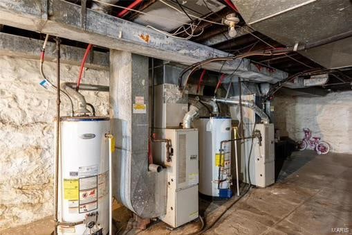 utility room featuring gas water heater and heating unit