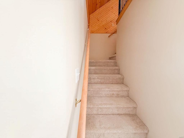 stairway featuring wood ceiling