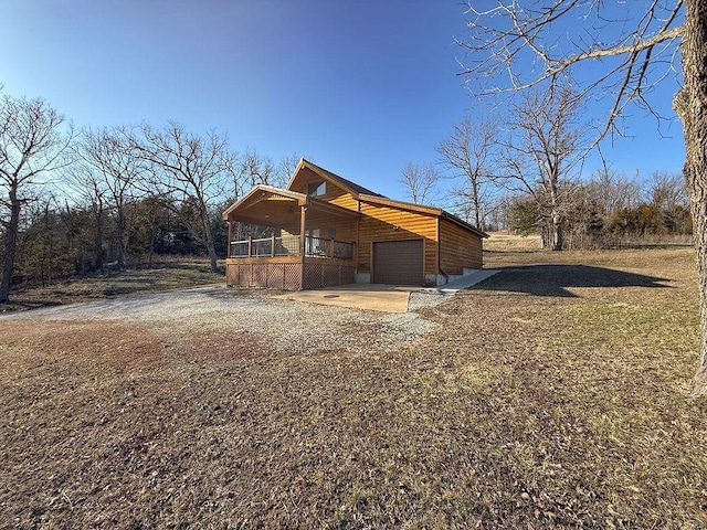 exterior space featuring driveway and an attached garage