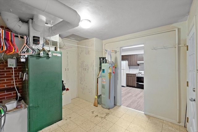 utility room featuring gas water heater