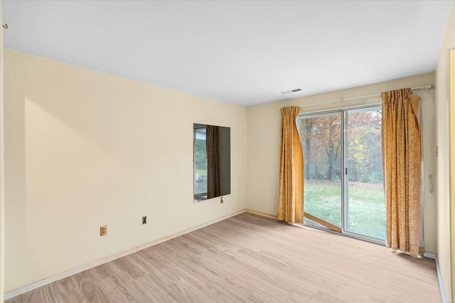 unfurnished room featuring light hardwood / wood-style floors