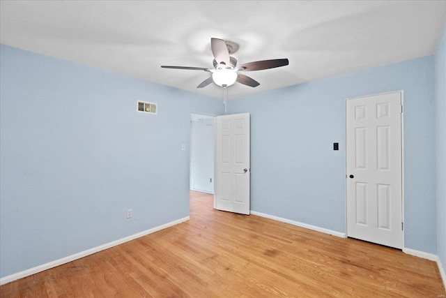 unfurnished room with ceiling fan and light hardwood / wood-style flooring