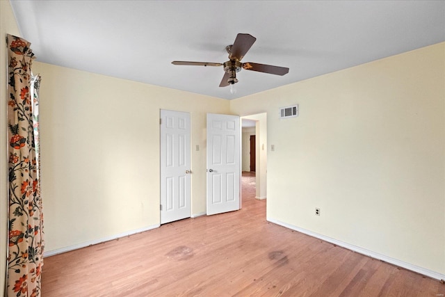 unfurnished bedroom featuring ceiling fan and light hardwood / wood-style flooring