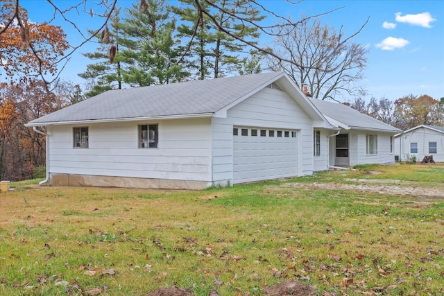 view of side of home with a yard