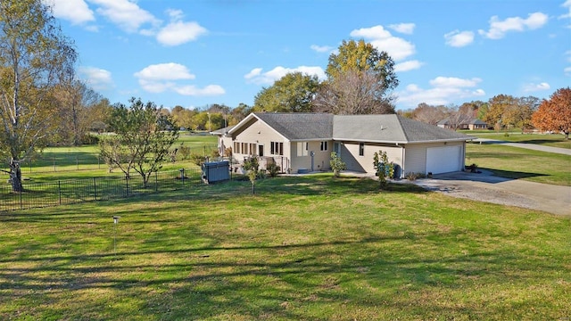 single story home with a garage and a front lawn