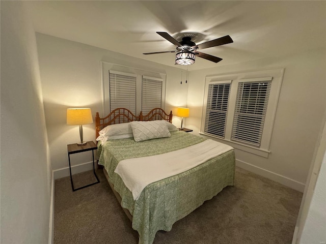 bedroom featuring ceiling fan and dark carpet