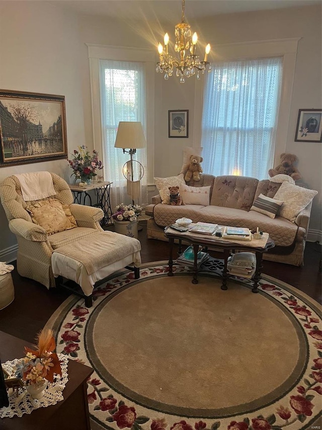 living room featuring hardwood / wood-style floors and a notable chandelier