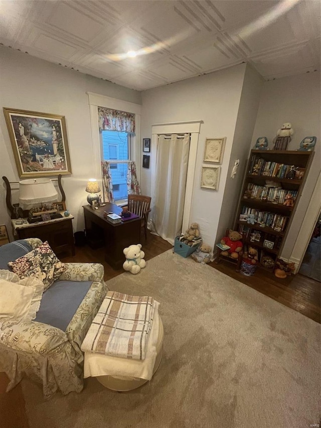 sitting room with dark hardwood / wood-style flooring