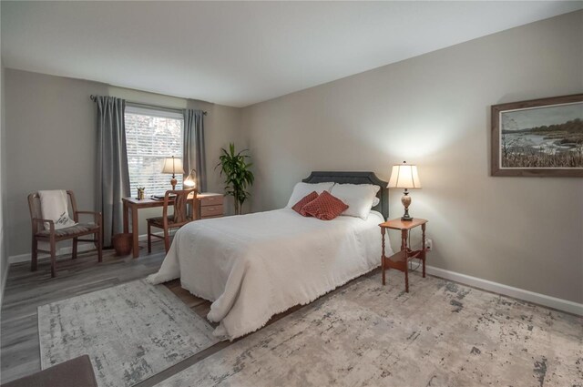 bedroom featuring wood-type flooring