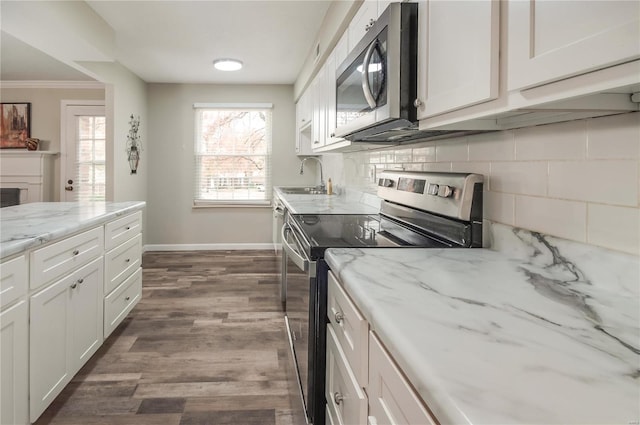 kitchen with white cabinetry, dark wood-type flooring, stainless steel appliances, and sink