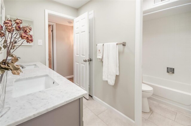 full bathroom with tile patterned flooring, vanity, toilet, and shower / washtub combination