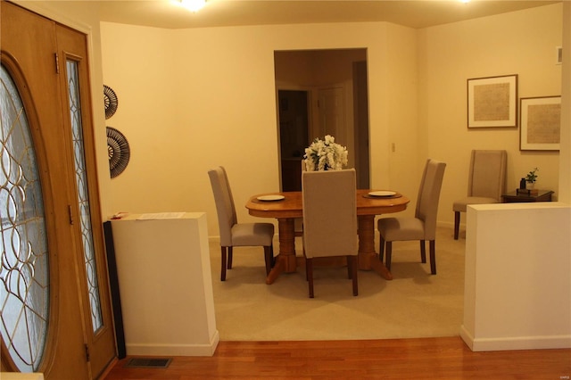 dining area featuring wood-type flooring