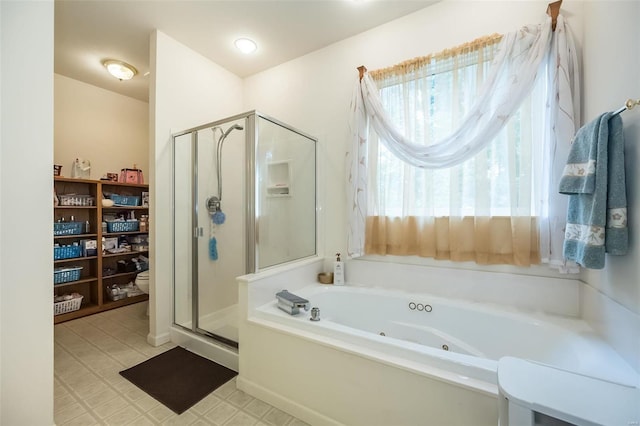 bathroom featuring toilet and independent shower and bath