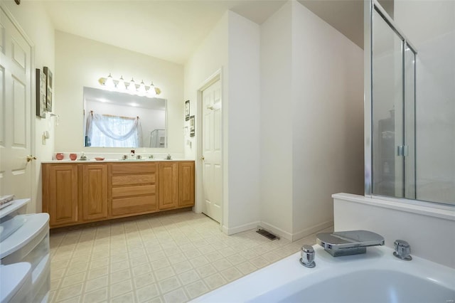 bathroom with vanity, tile patterned floors, and independent shower and bath