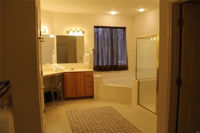 bathroom with vanity and independent shower and bath