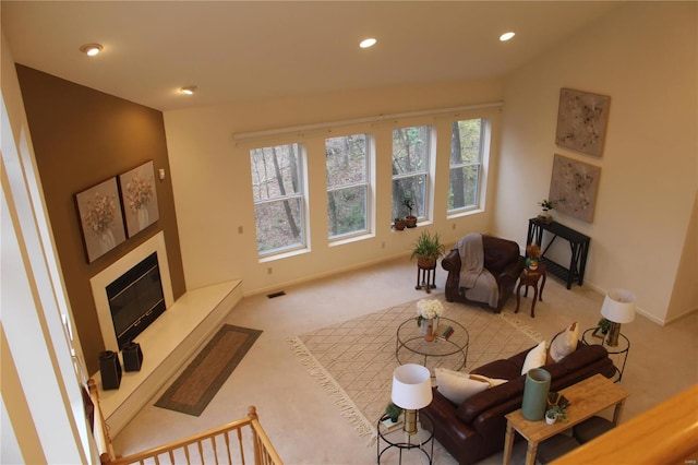 living room featuring a healthy amount of sunlight and light colored carpet