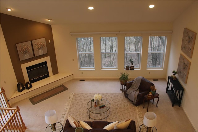 carpeted living room with a healthy amount of sunlight