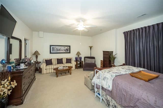 bedroom featuring light carpet and ceiling fan