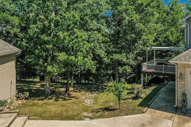 view of yard with a wooden deck