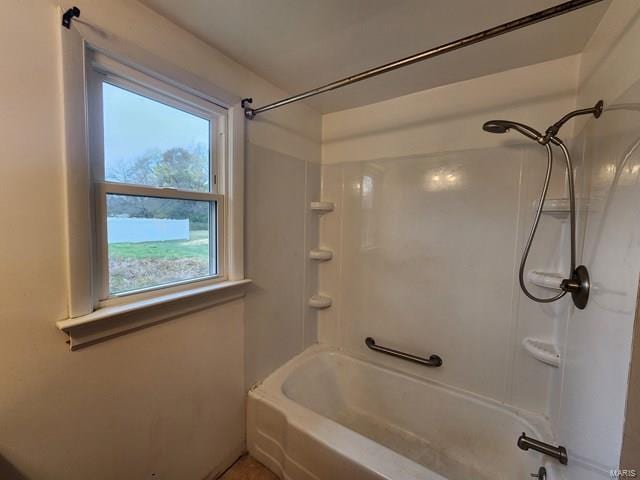 bathroom with shower / washtub combination