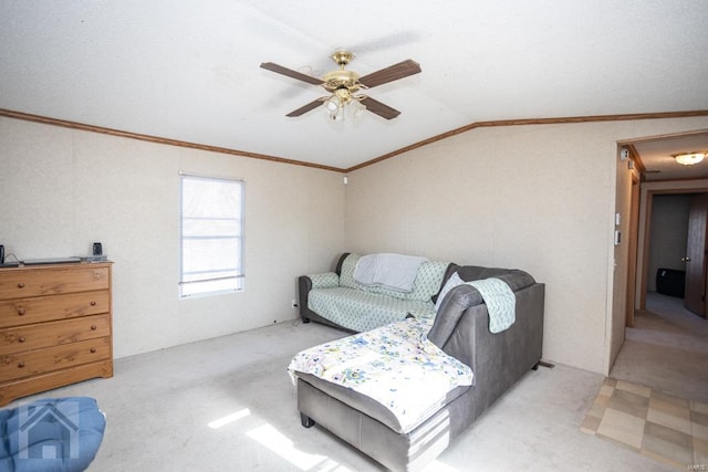 carpeted living room featuring crown molding, ceiling fan, and lofted ceiling