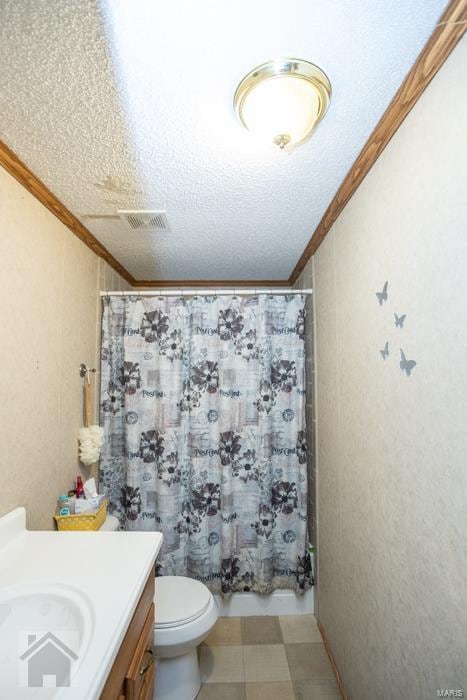 bathroom featuring walk in shower, ornamental molding, a textured ceiling, vanity, and toilet