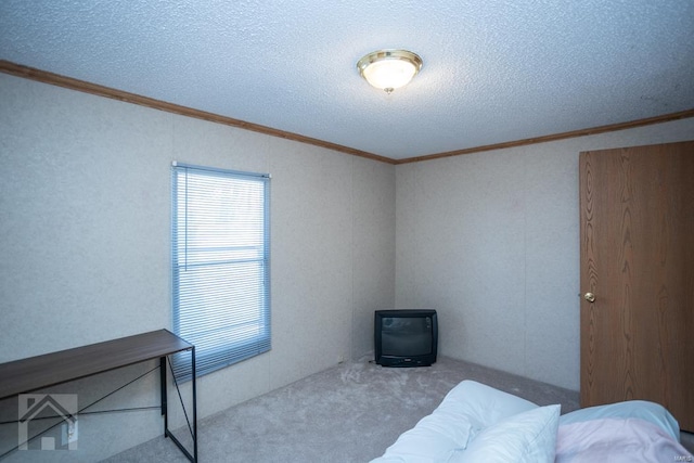 carpeted bedroom featuring crown molding and a textured ceiling