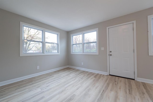 spare room featuring light wood-type flooring