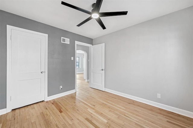 unfurnished bedroom featuring ceiling fan and light hardwood / wood-style floors