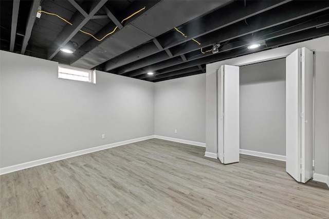 basement featuring light hardwood / wood-style floors