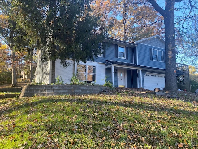 view of front property with a garage and a front lawn