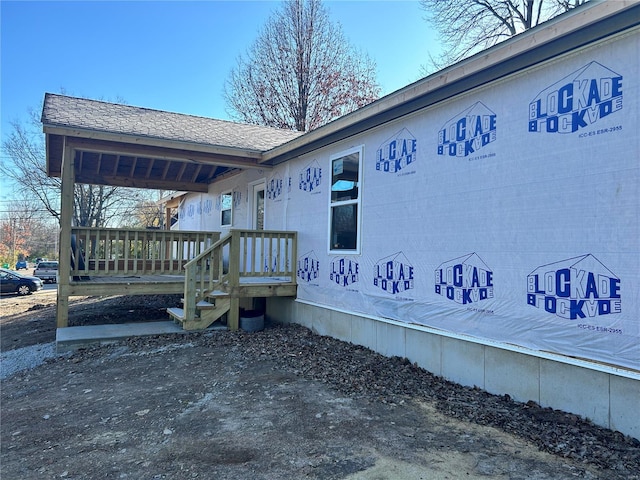 view of property exterior featuring a porch