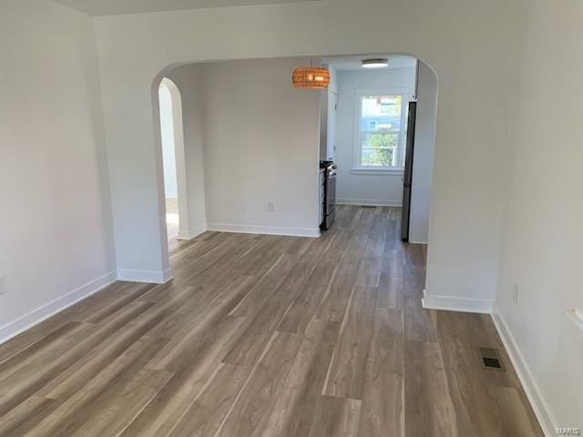 spare room with hardwood / wood-style flooring