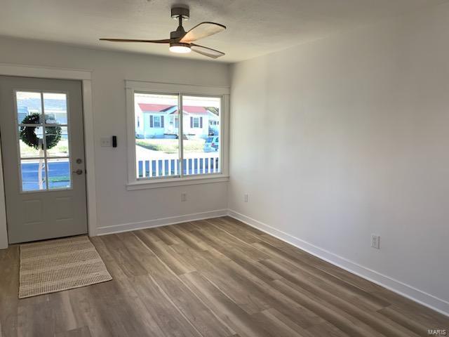 entrance foyer with hardwood / wood-style floors and ceiling fan