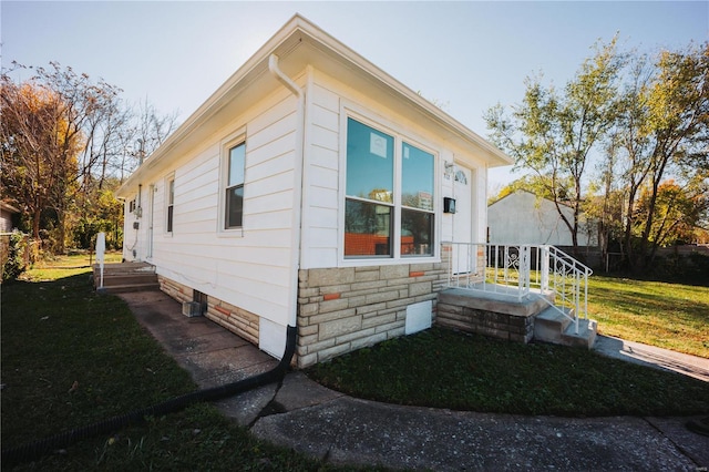 view of home's exterior featuring a yard