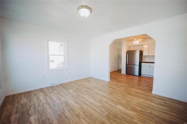 unfurnished living room with light hardwood / wood-style floors