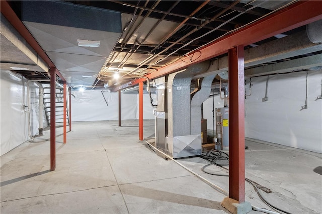 basement featuring heating unit and water heater