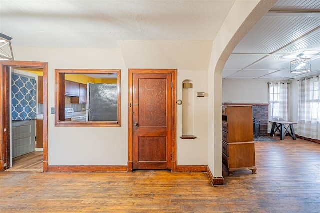 corridor featuring wood-type flooring