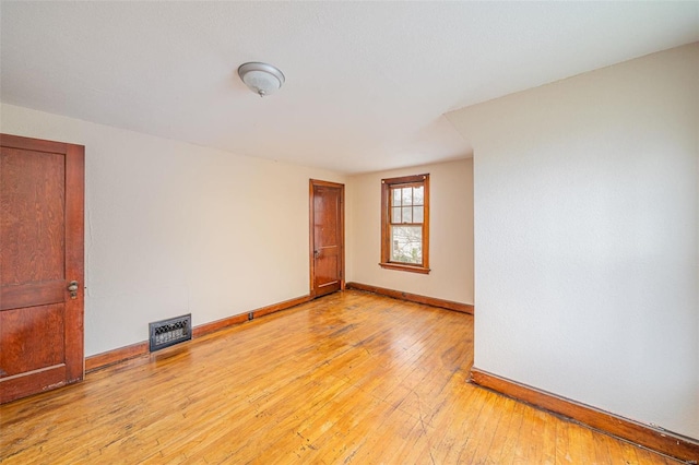 unfurnished room with light hardwood / wood-style flooring