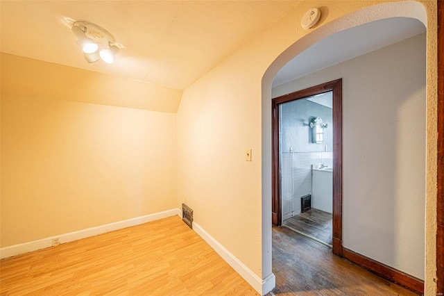 hallway with wood-type flooring