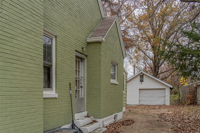 view of property exterior featuring an outbuilding and a garage