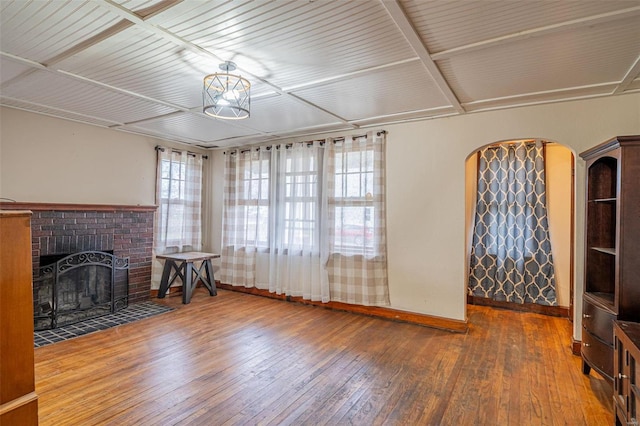 unfurnished living room with hardwood / wood-style flooring and a fireplace