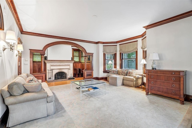 carpeted living room with ornamental molding