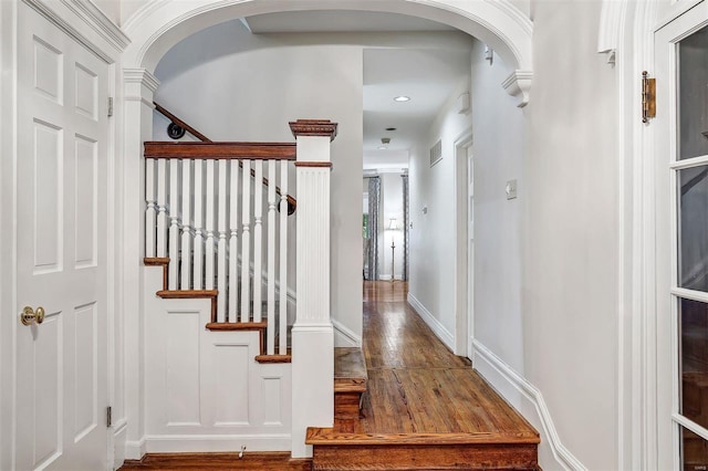 stairway featuring wood-type flooring